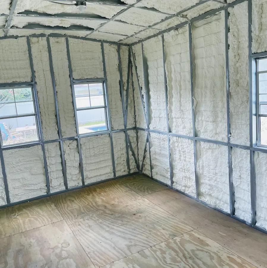 Closed-cell spray foam insulation applied to wall cavities in a residential project in Kelso